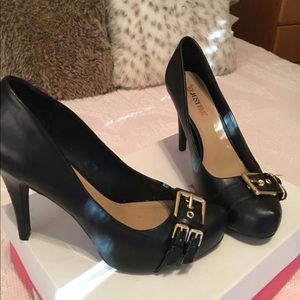 Black heels with gold buckle